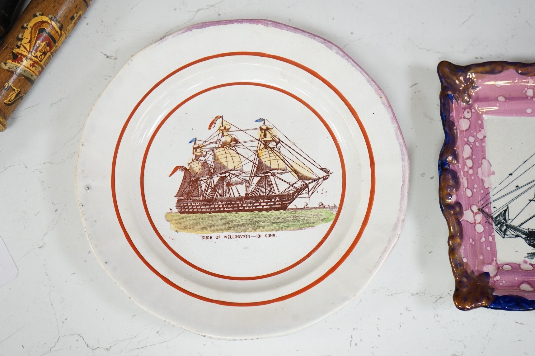 A 19th century Sunderland pink lustre ‘ship’ plaque and an HMS, Duke of Wellington plate, largest 24cm in diameter